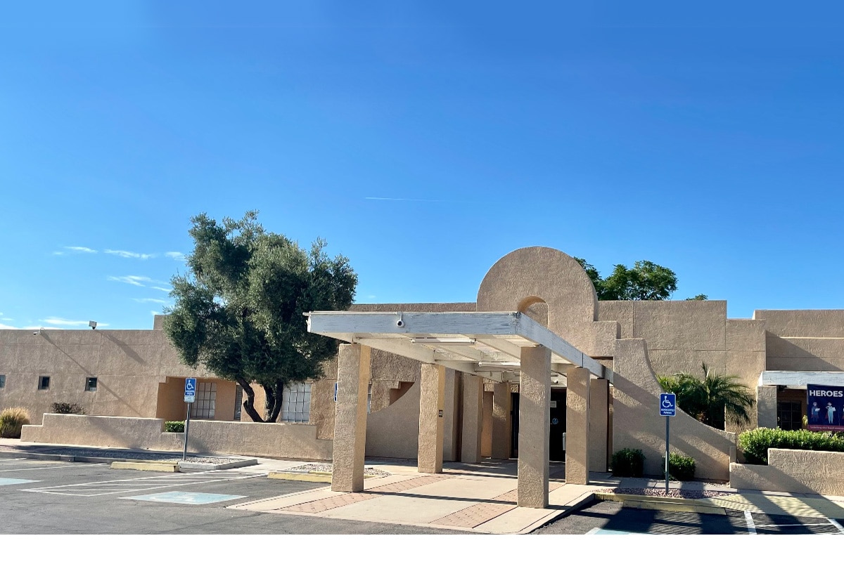 Front of facility with adobe arches