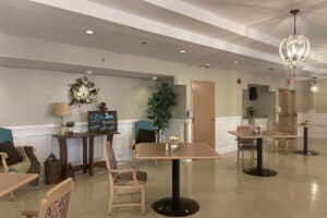 Close up of dining table including chalkboard menu in background